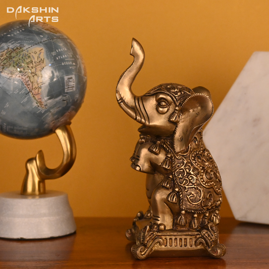 BABY ELEPHANT SITTING - Dakshin Arts