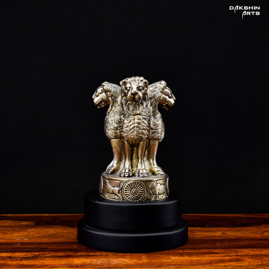 A brass statue of Ashoka Pillar with four lions standing back-to-back on a round base - Dakshin Arts