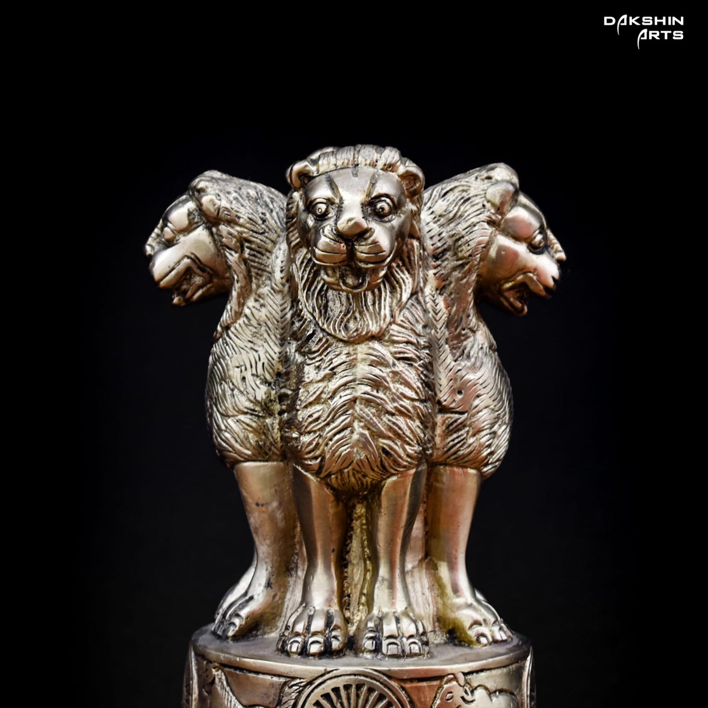 A brass statue of Ashoka Pillar with four lions standing back-to-back - Dakshin Arts
