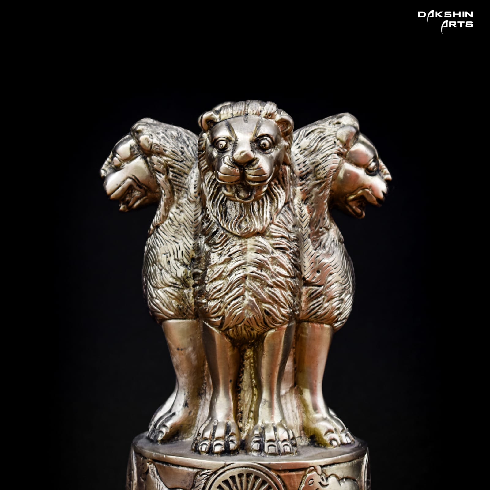 A brass statue of Ashoka Pillar with four lions standing back-to-back - Dakshin Arts