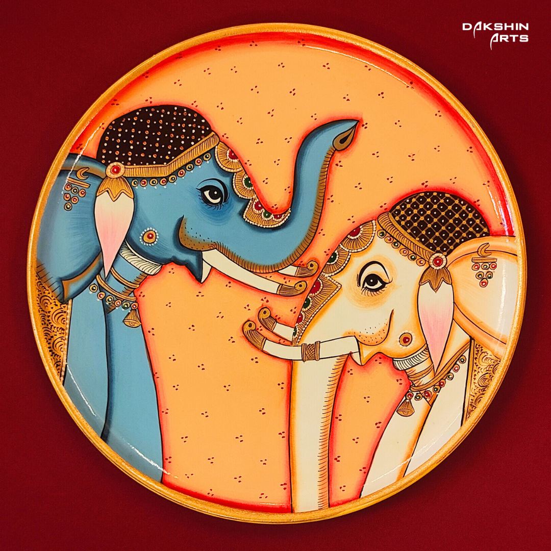A Pichwai wall plate with two intricately painted elephants facing each other- Dakshin Arts