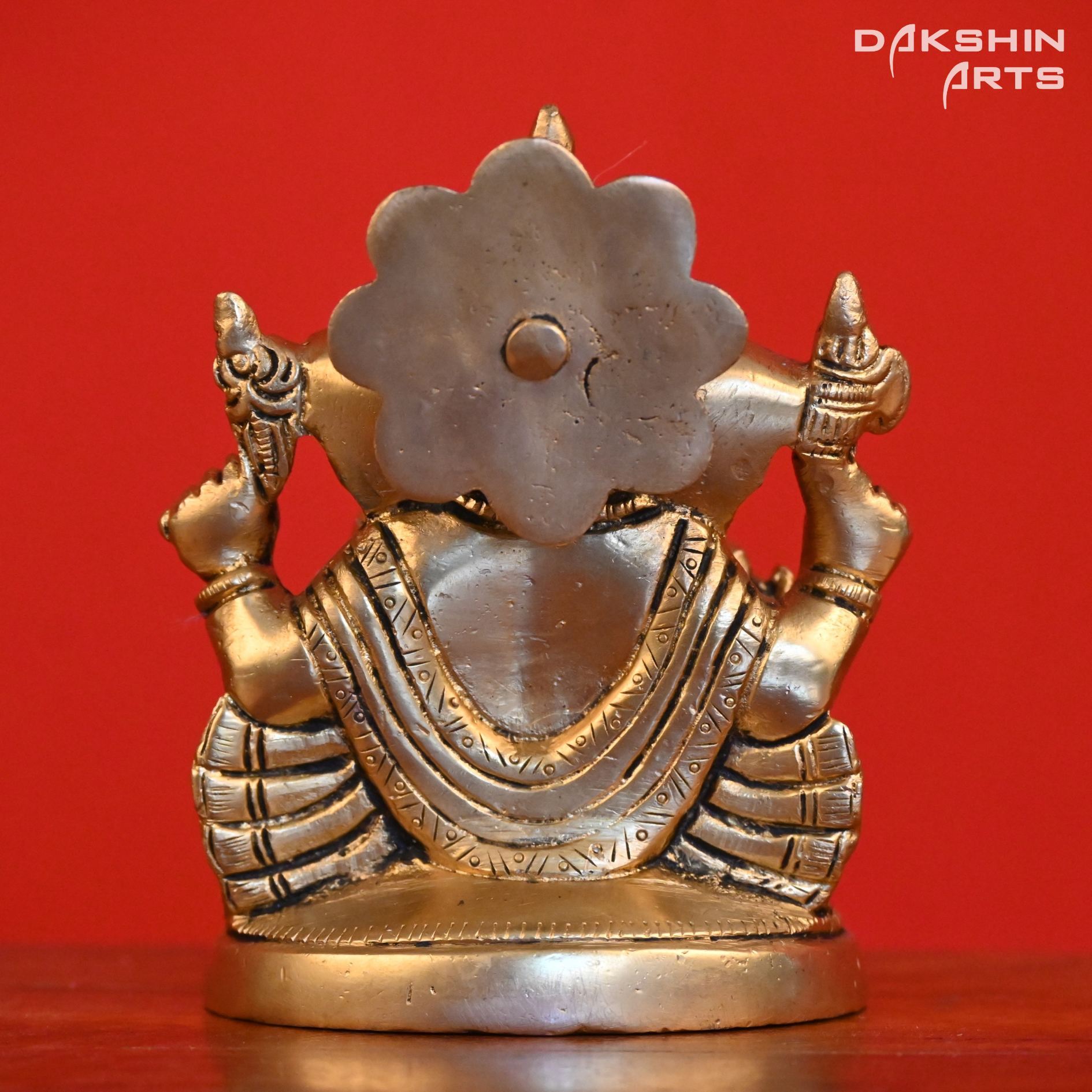 GANESH SITTING ON ROUND BASE - Dakshin Arts