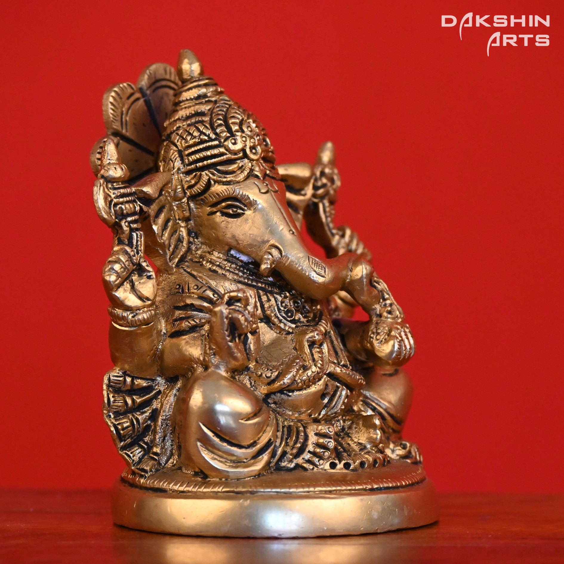 GANESH SITTING ON ROUND BASE - Dakshin Arts