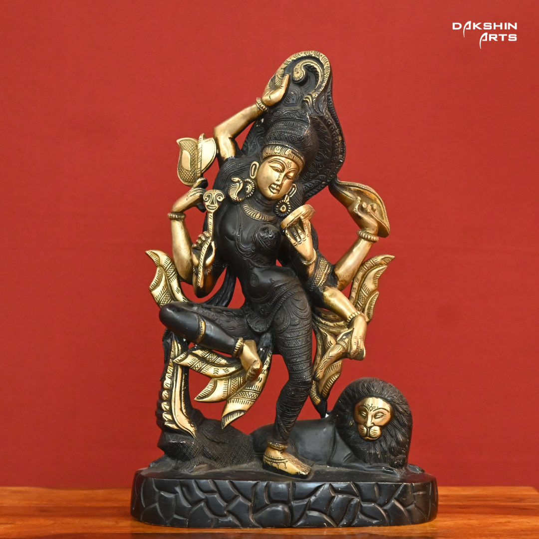 A black gold colored statue of Ardhanareshwar adorned with detailed patterns, with a lion at the base- Dakshin Arts