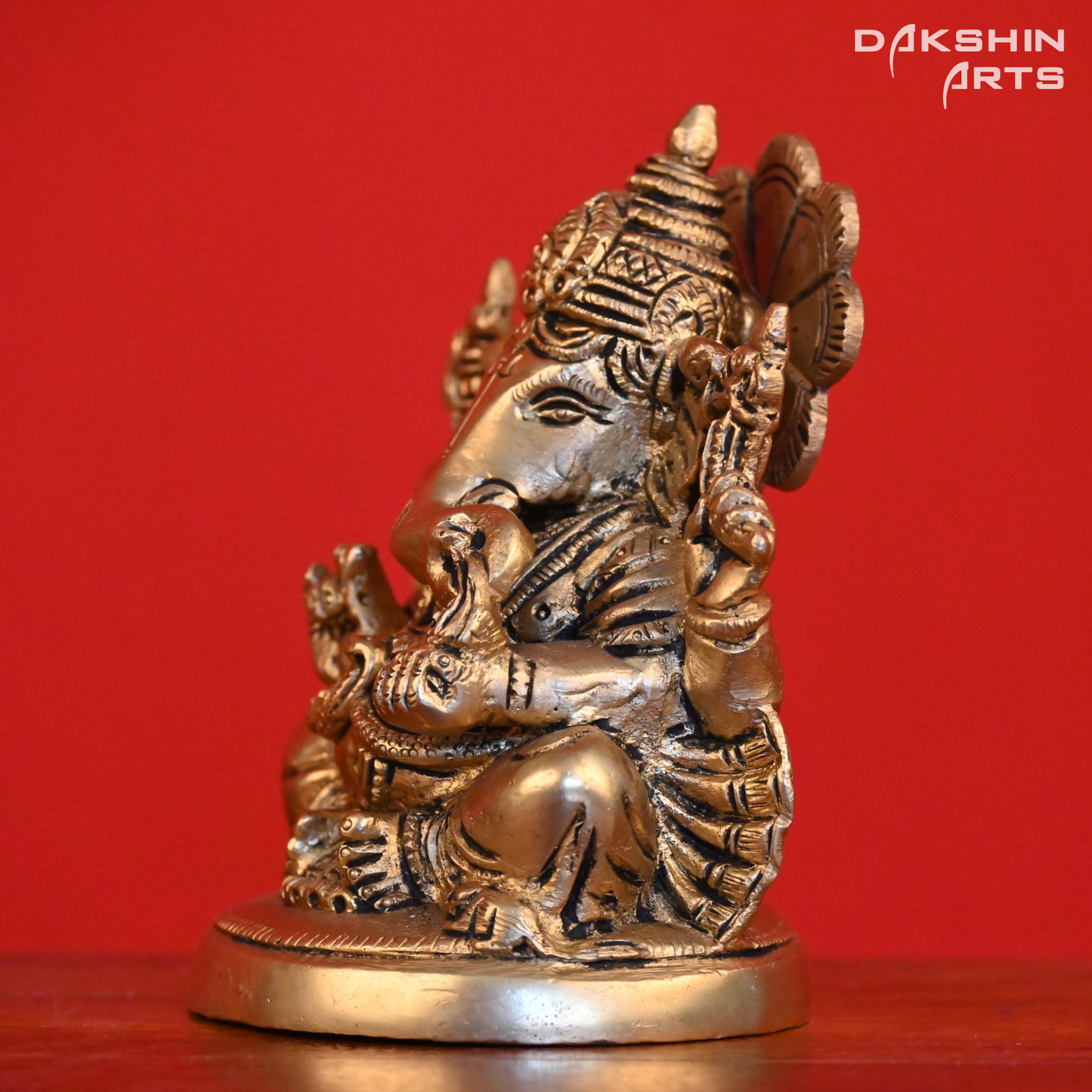 GANESH SITTING ON ROUND BASE